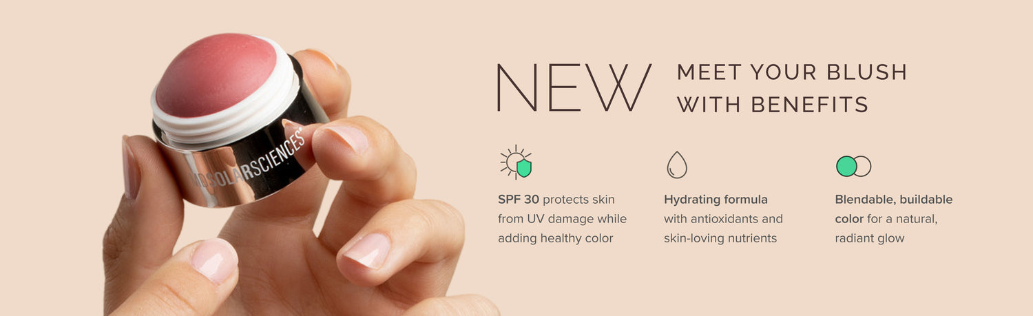 Cosmetic blush stick with a hand holding it, set against a beige background.