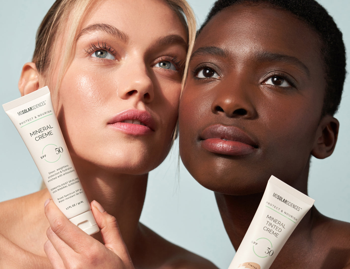 Two women showing MDSolar Sciences sunscreen