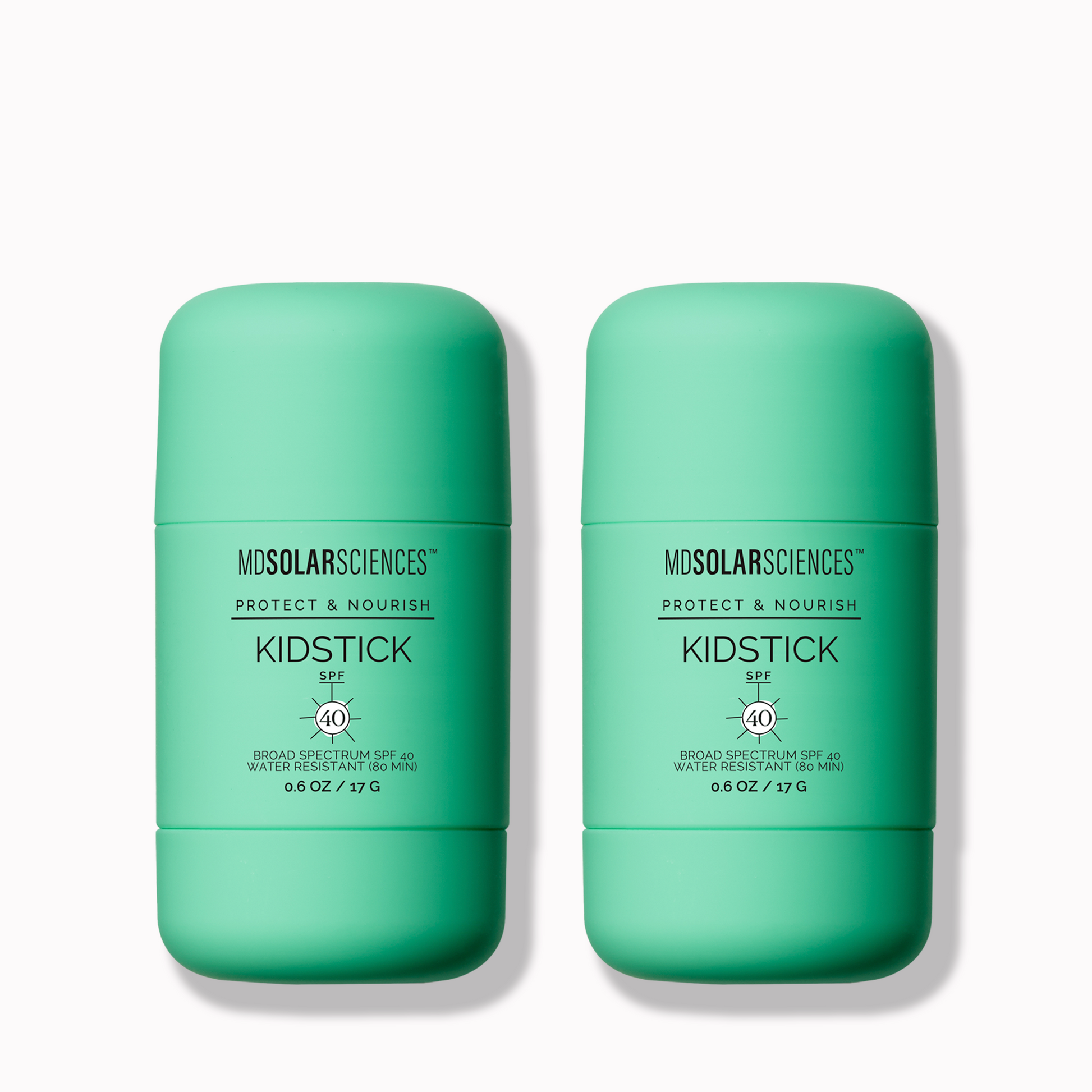Two green containers of Mdsosolarsciences Kidstick
