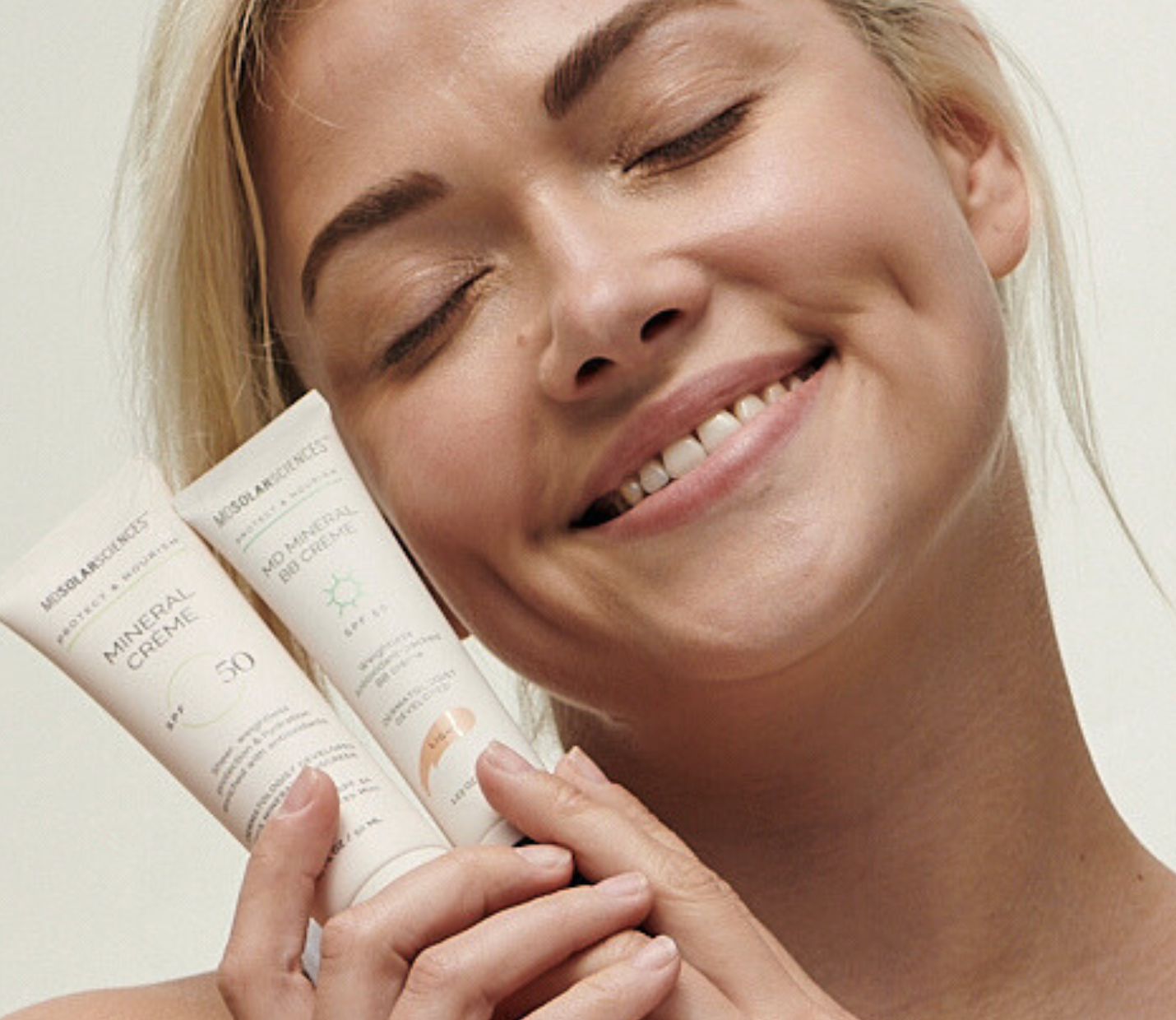 Woman holding skincare products