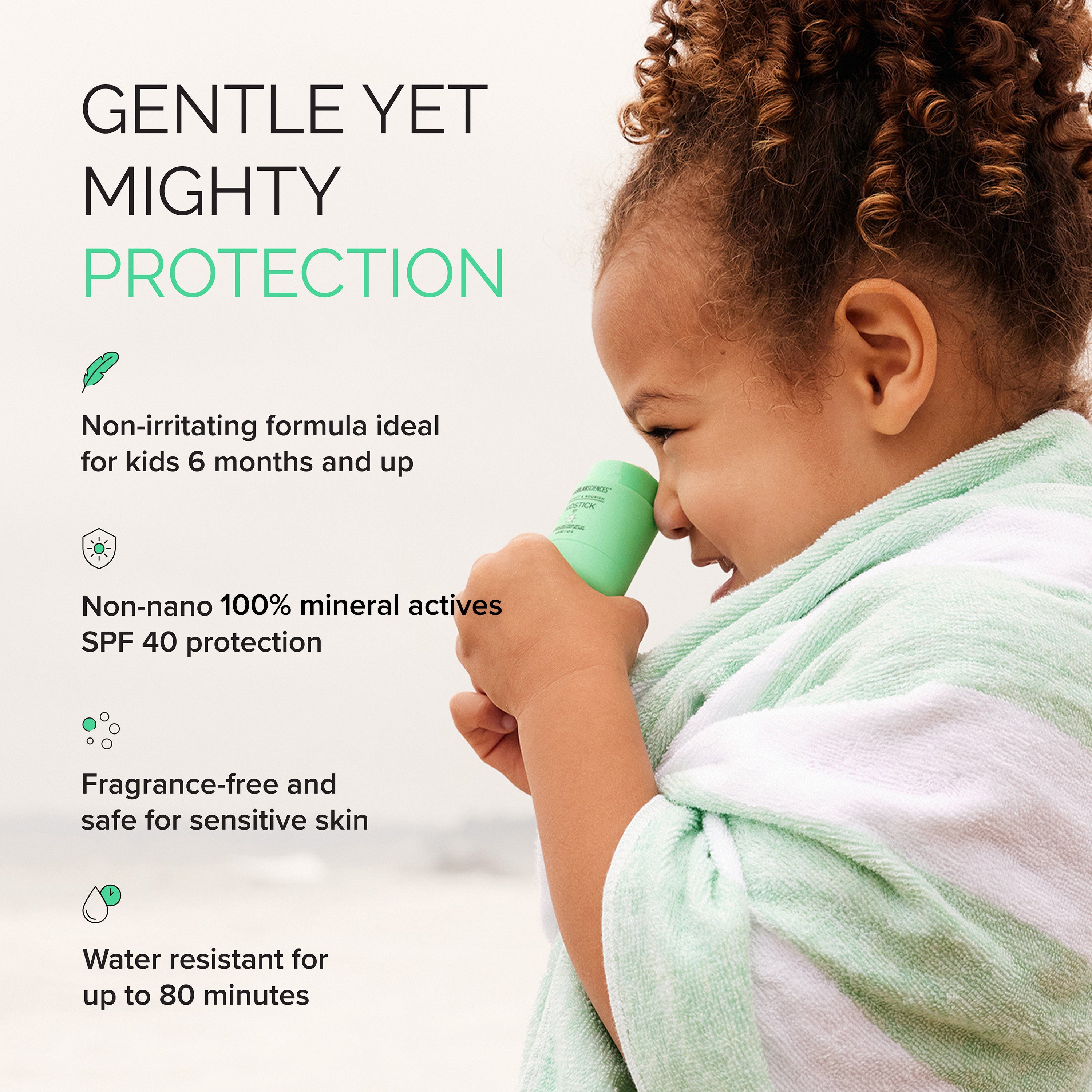 Child holding a green sunscreen product with text about its features