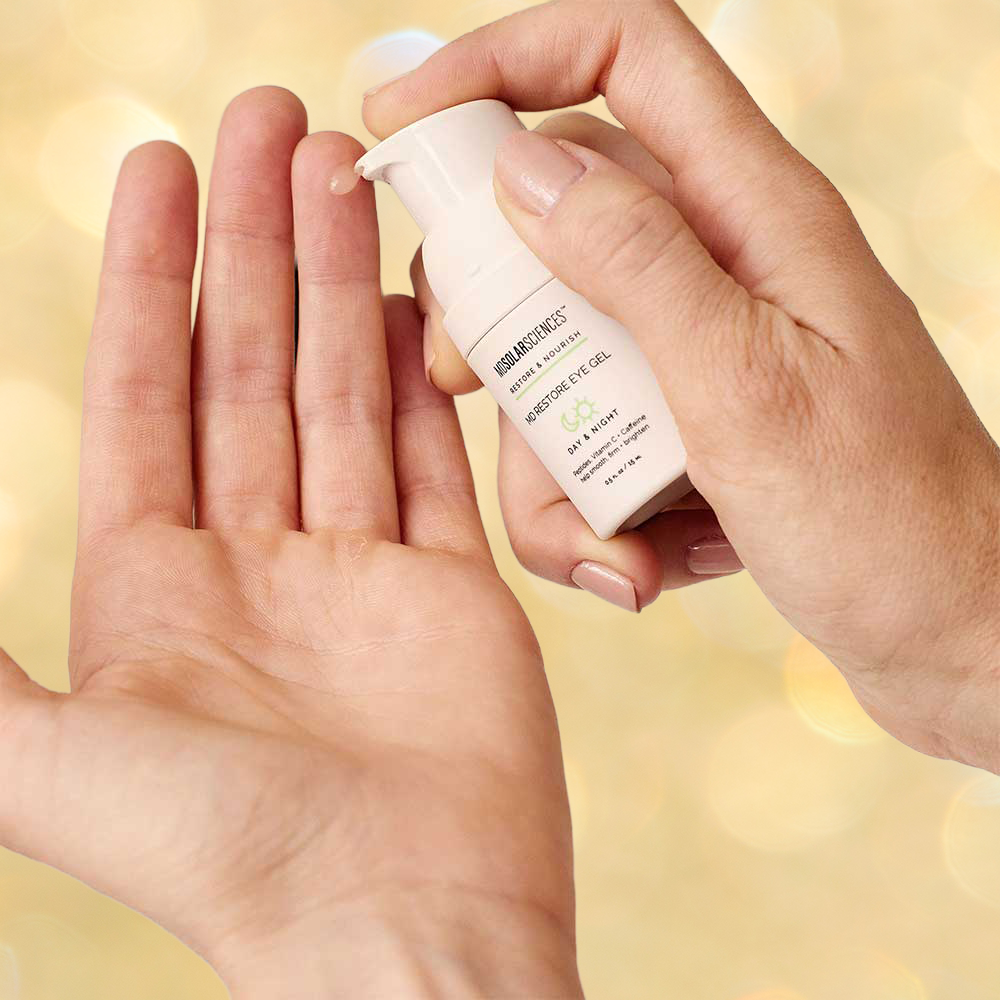 applying eye gel to finger tips