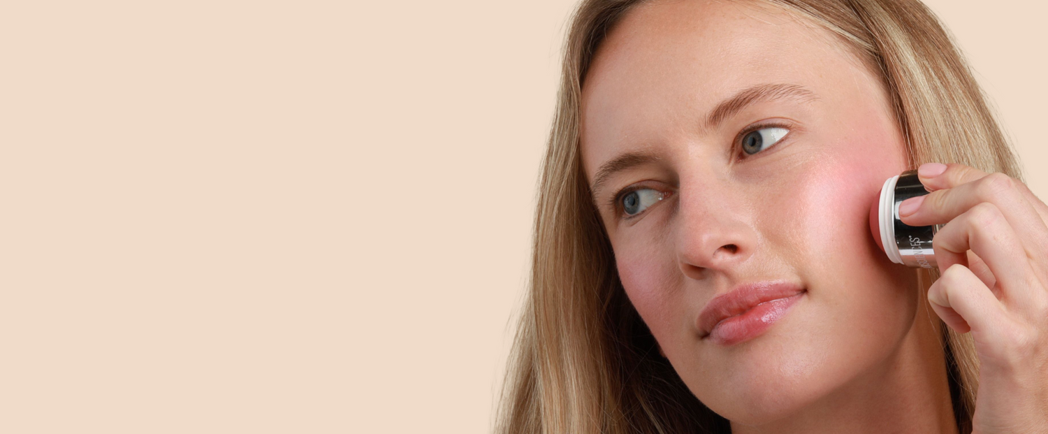 model applying cheek creme