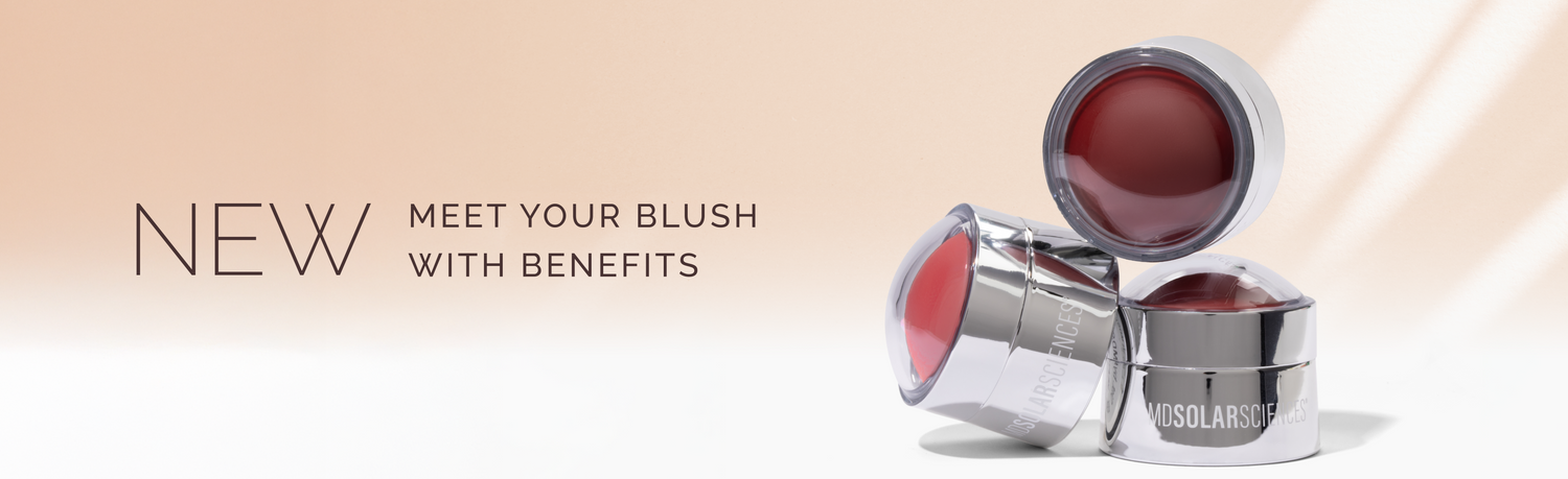 Two silver blush pots with red blush on a beige background, featuring text about new blush with benefits.